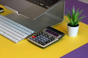 Swiss Social Security Contributions accounting environment with desktop accessories and calculator