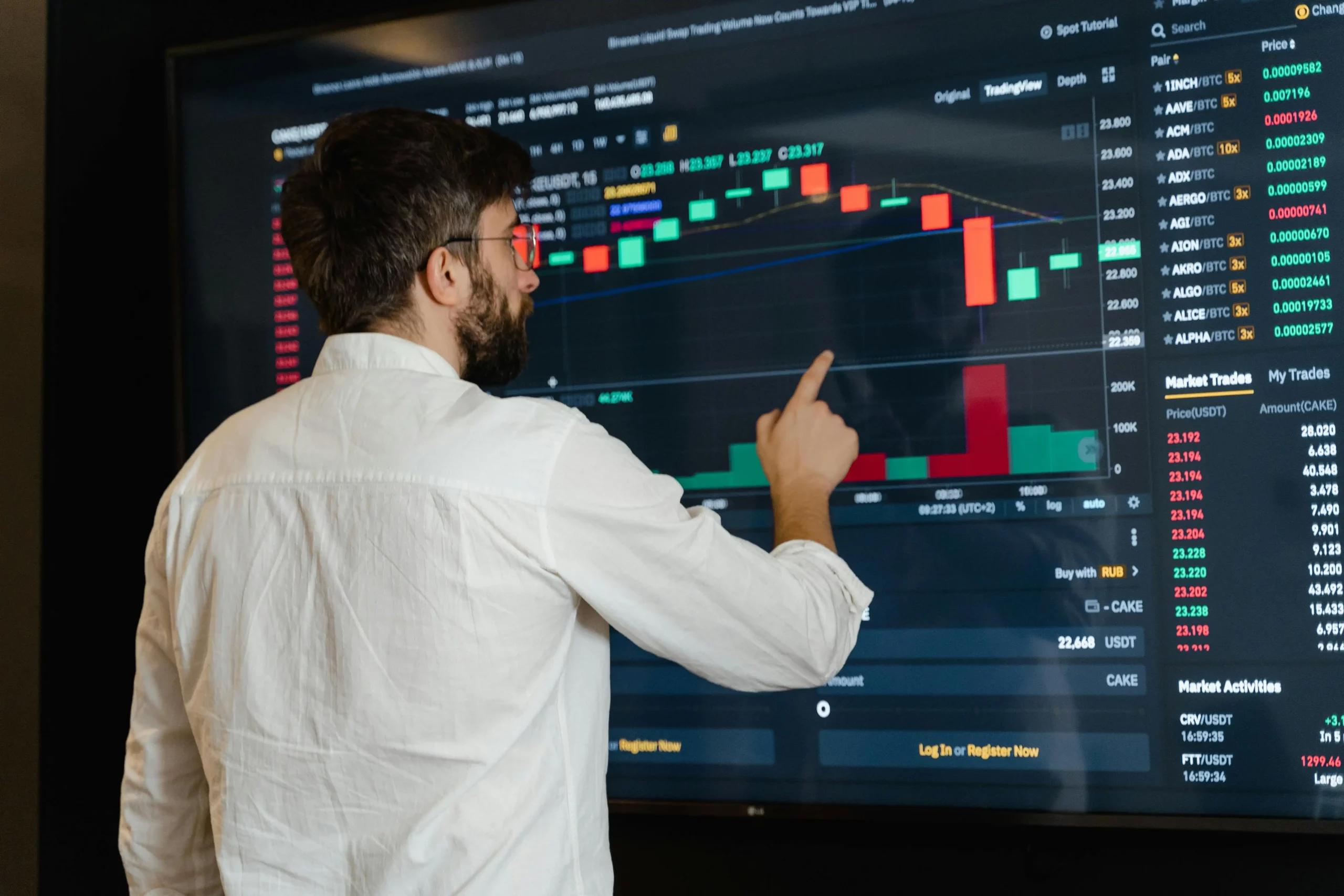A man checking a dashboard on timekeeping software that displays tracked hours, productivity metrics, and work activity