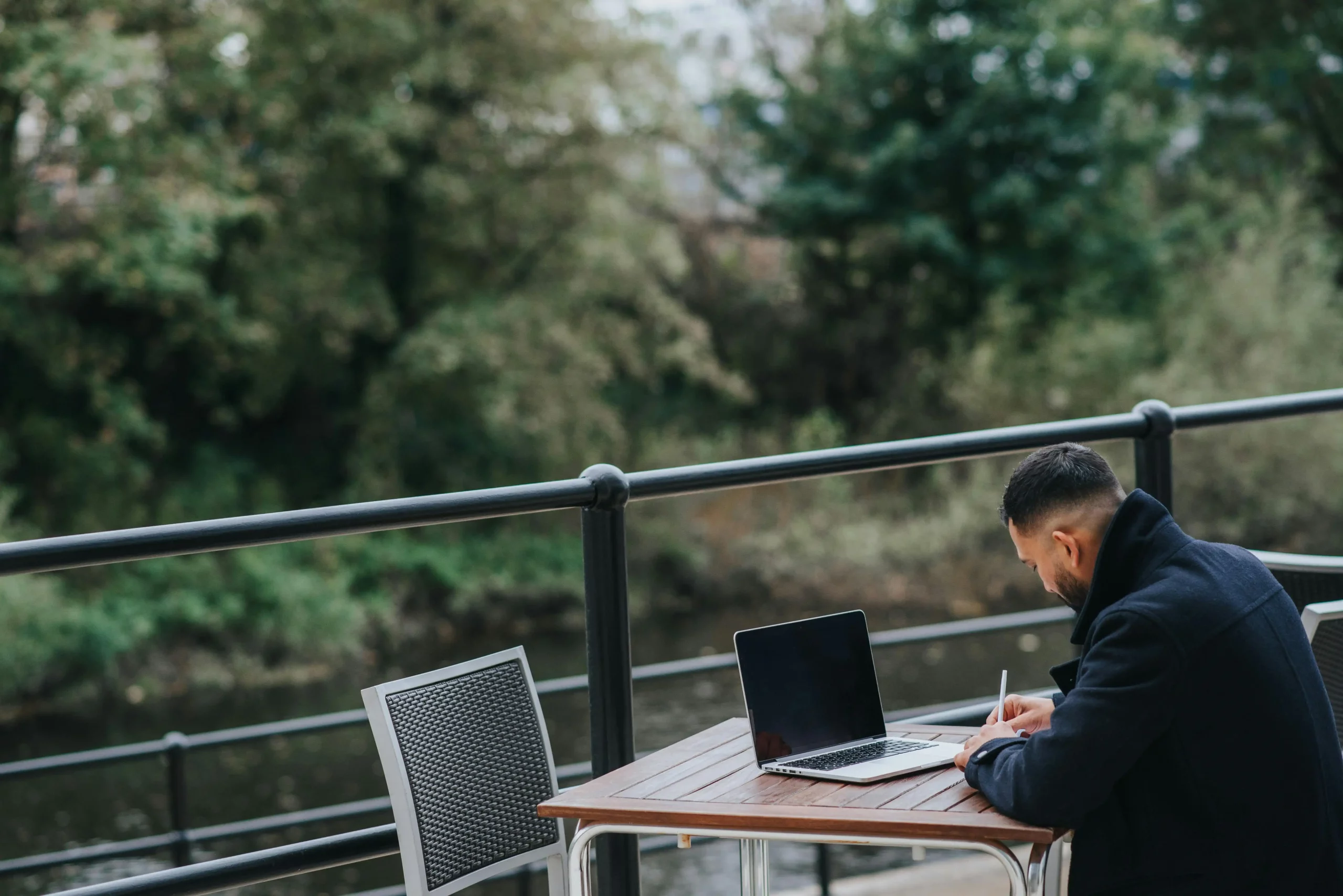 Man working on a laptop from a flexible location of his choice, representing remote employees in a comfortable and adaptable workspace.