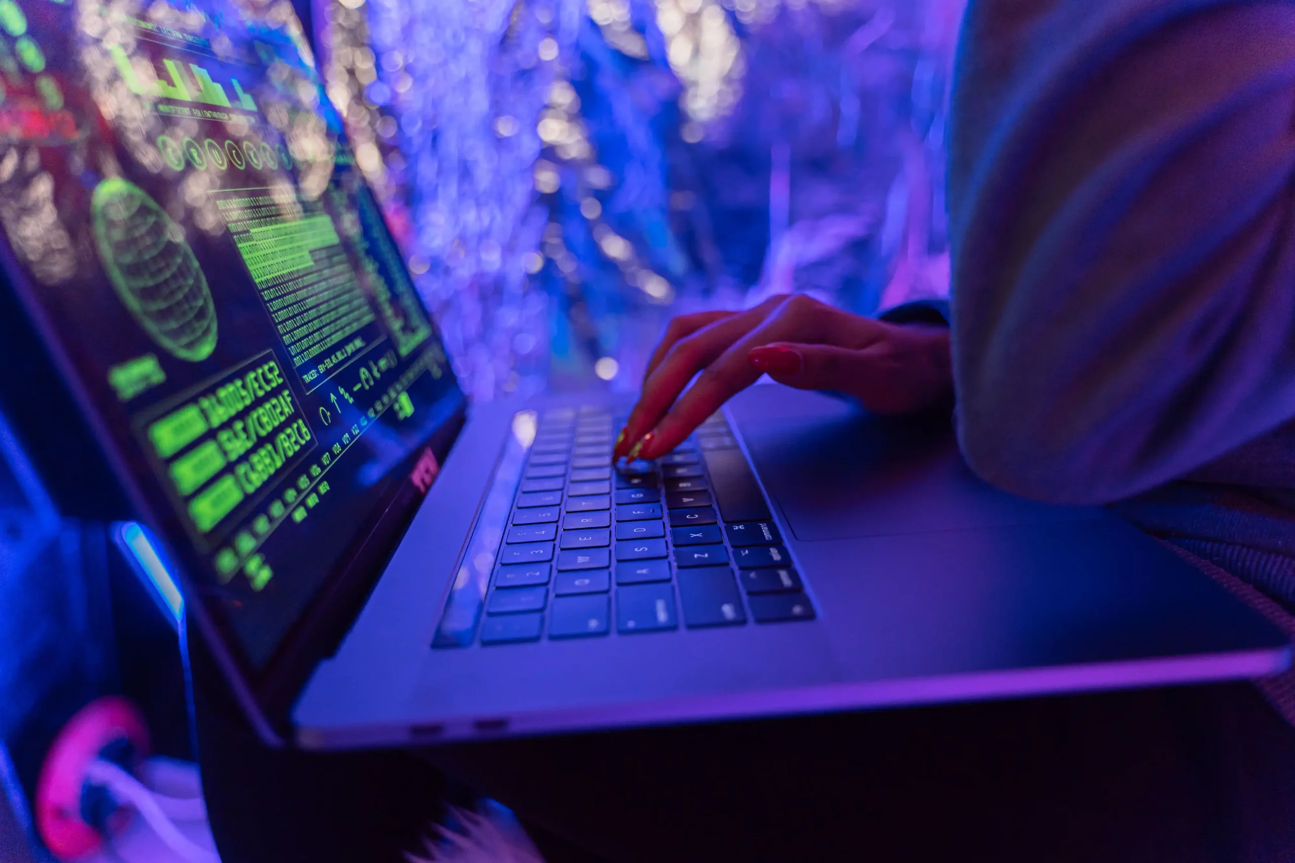 Laptop displaying a payroll cybersecurity dashboard with encrypted salary records, security alerts, and access control indicators.