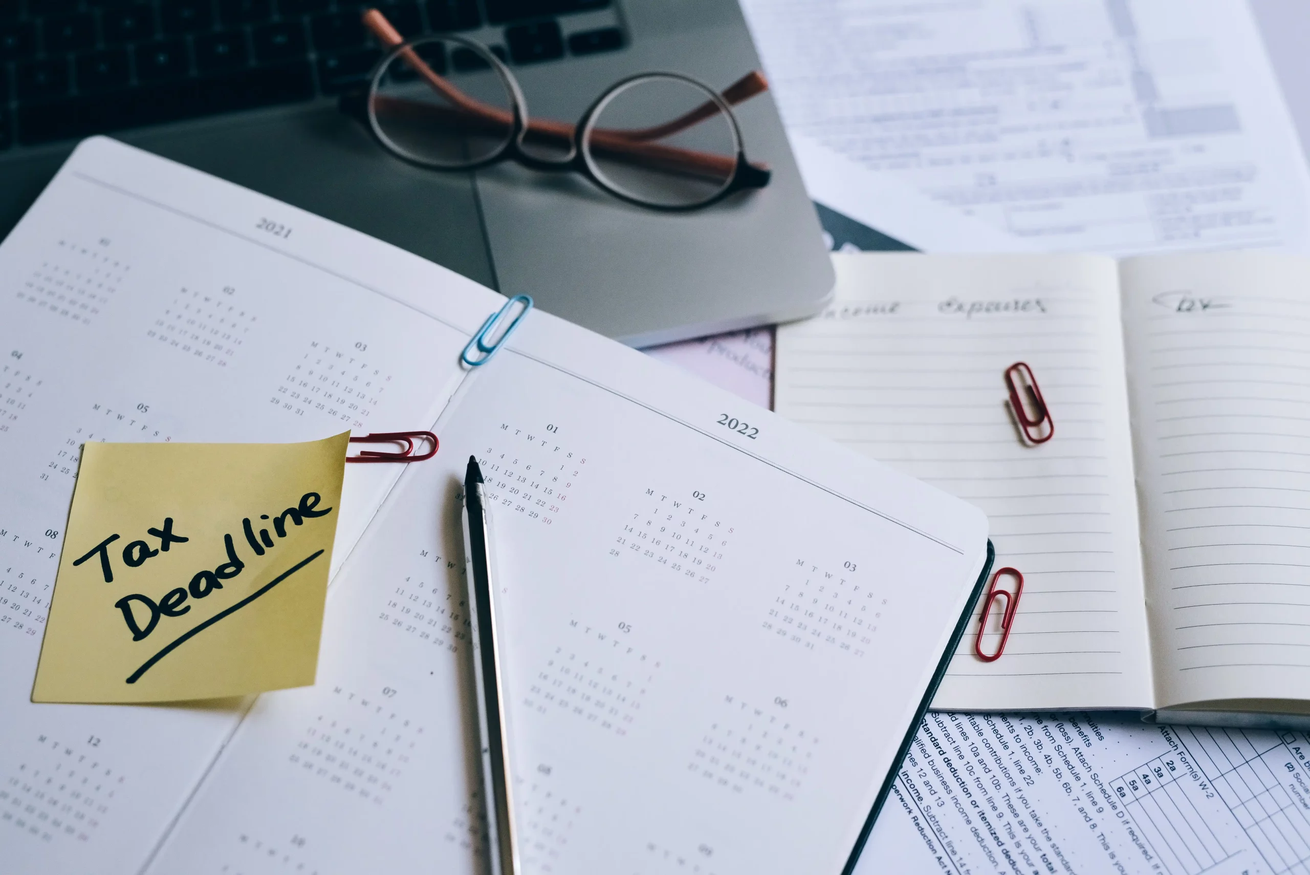 Swiss payroll tax form alongside a payroll deadline calendar, illustrating employer tax filing obligations, salary processing schedules, and payroll compliance requirements in Switzerland.