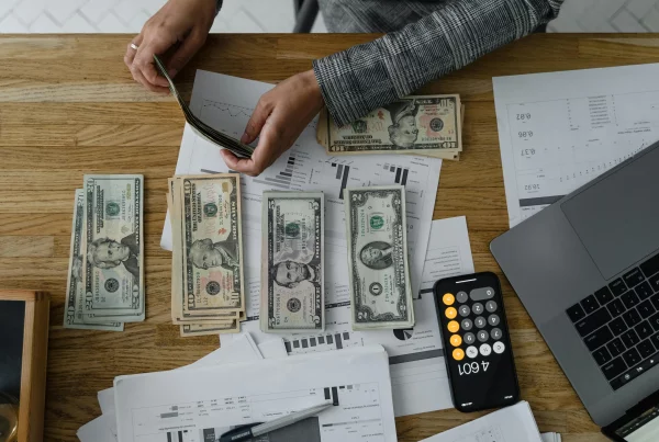 Stack of money representing employee salary package, compensation, wages, and financial benefits.