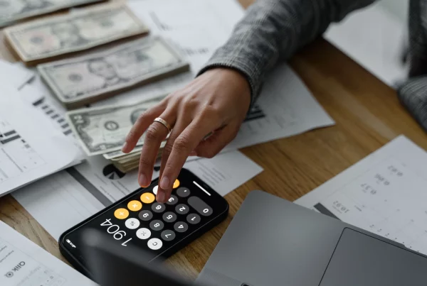 Payroll specialist processing employee salaries, deductions, and payroll reports