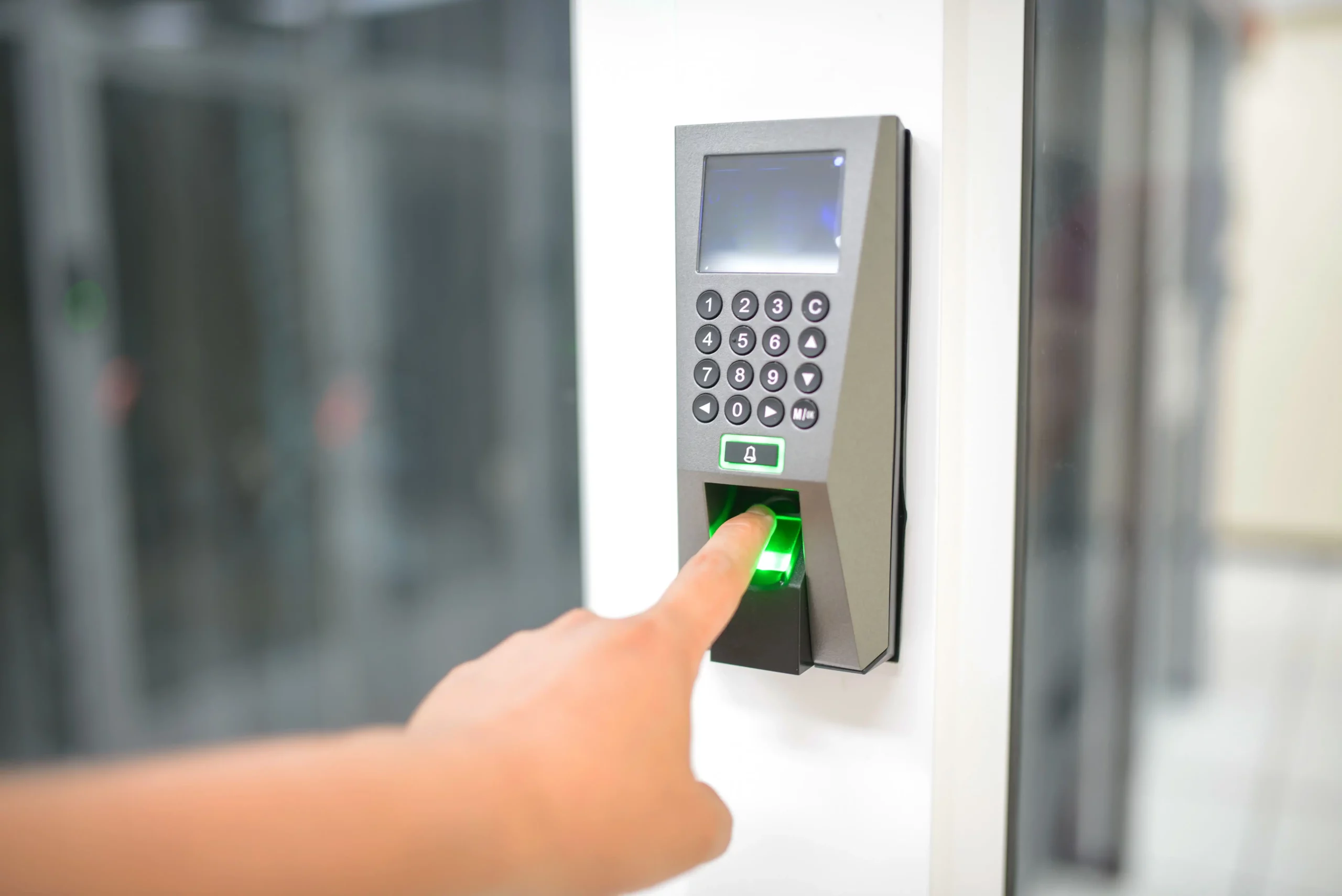 Fingerprint biometric scanner used to record employee attendance in a time tracking system