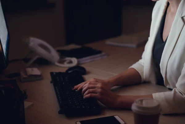 Employee working overtime at a desk in Switzerland